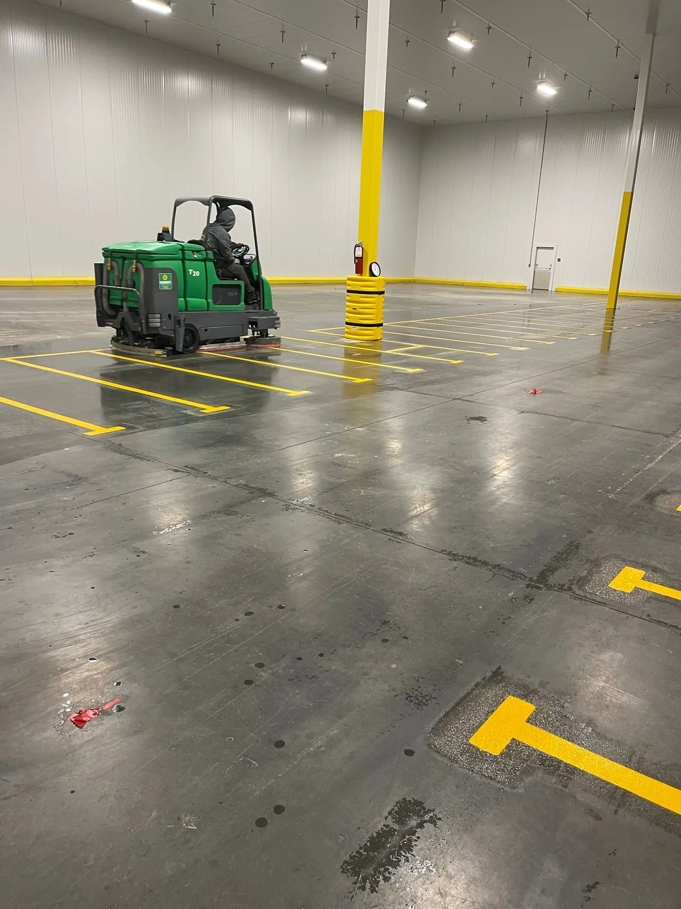 Machine floor scrubbing of hard-surface flooring in a commercial facility