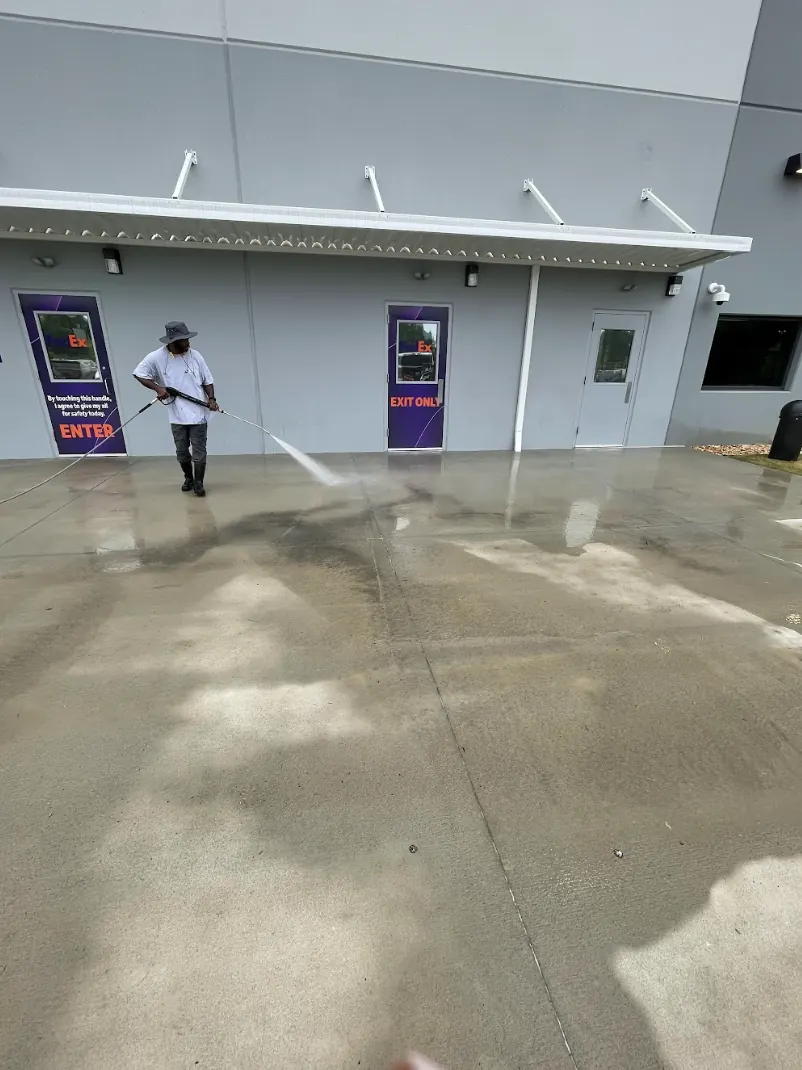 Pressure washing a commercial sidewalk and entryway