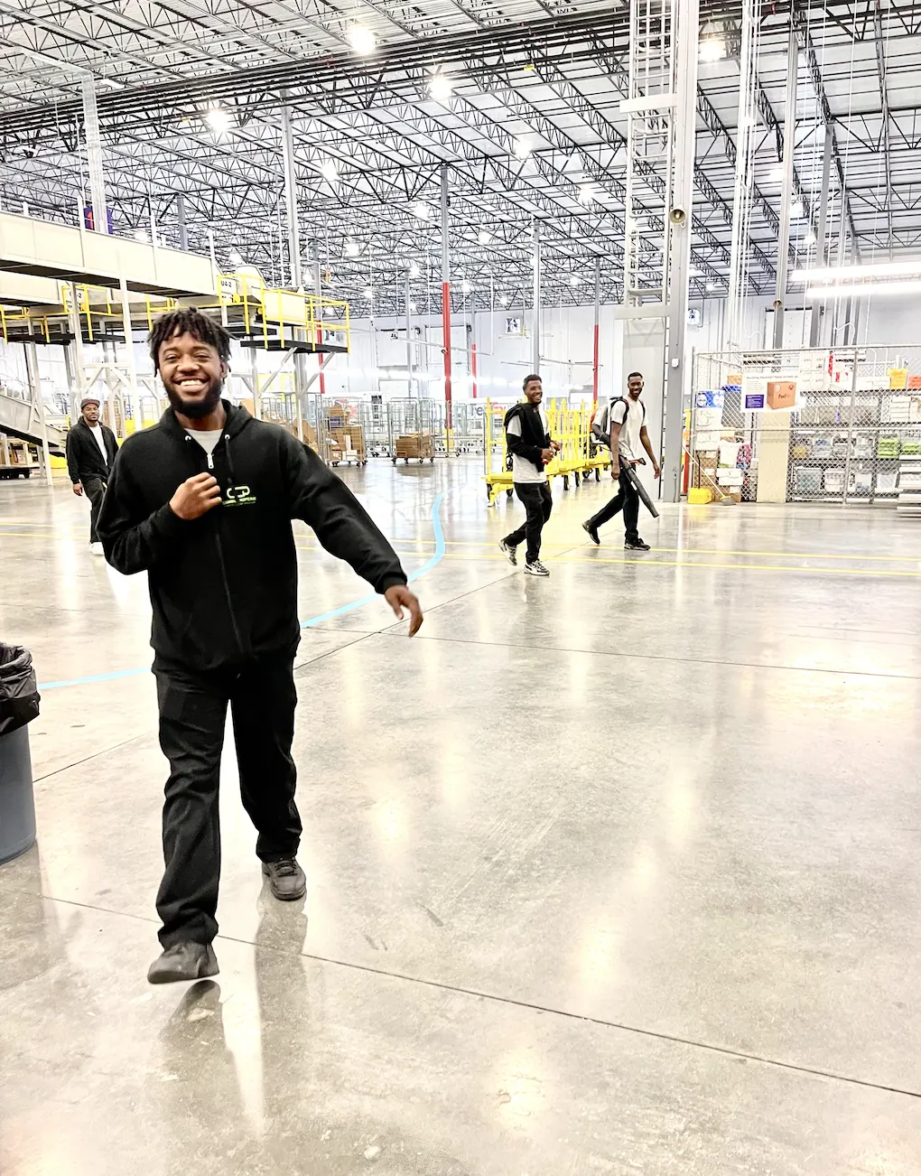 Cleaning Concepts Plus commercial cleaning crew smiling together in branded uniforms